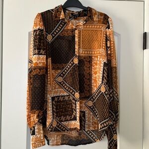 DONATED ITEM - Stylish Patterned Button Down Blouse